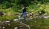 Lynn balancing on rocks